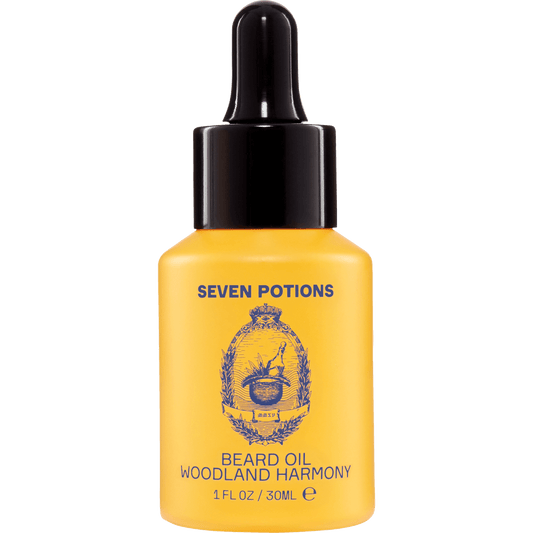 Yellow bottle of Seven Potions Woodland Harmony beard oil on a clear background
