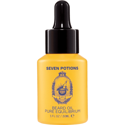 Yellow bottle of Seven Potions beard oil with a black dropper on a clear background