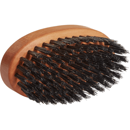 Wooden brush with black bristles on a transparent background