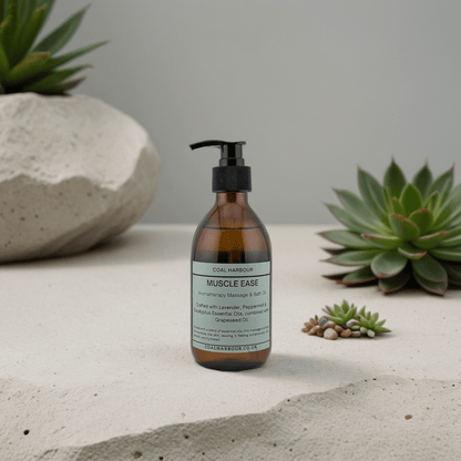 Bottle of 'Muscle Ease' on a concrete surface with succulents in the background
