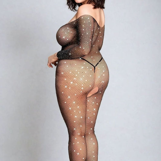 lady wearing sparkling body stocking over black pants. From back view.