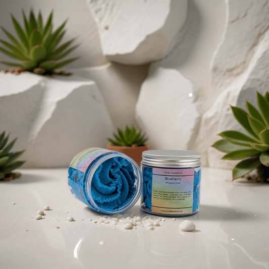 Two containers with blue rolled-up towels on a white surface with plants in the background