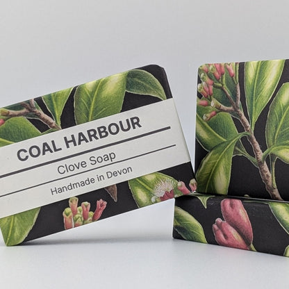 Two bars of Coal Harbour Clove Soap with botanical design on a white background