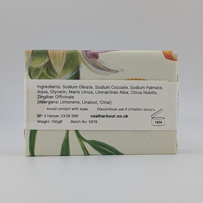Bar of soap with botanical design on a white background