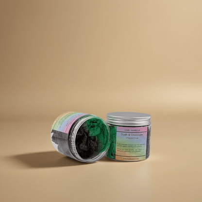 Open jar of hair product with colorful label on a beige background
