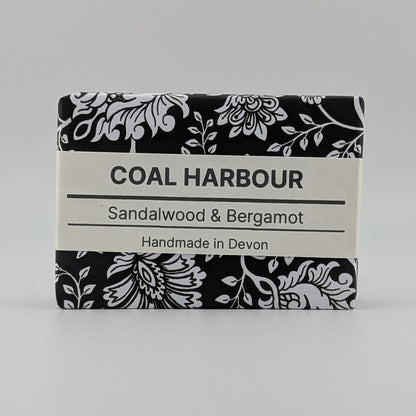 Bar of soap with 'Coal Harbour' branding on a gray background