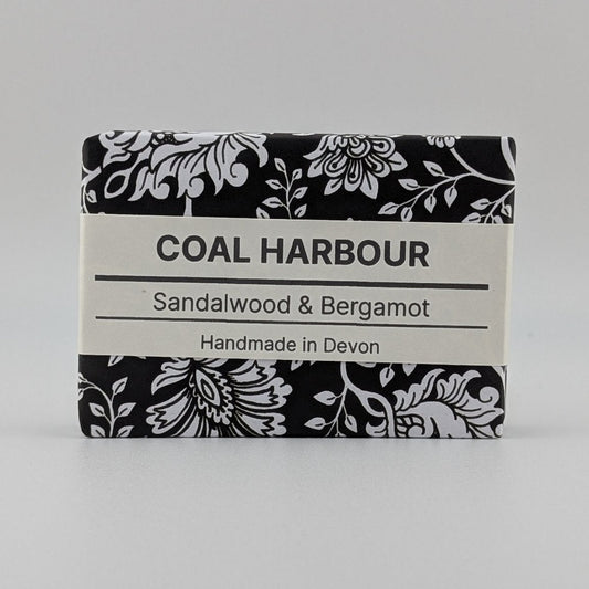 Bar of soap with 'Coal Harbour' branding on a gray background