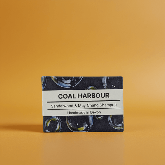 Bar of Coal Harbour Sandalwood & May Chang Shampoo on an orange background