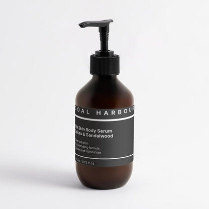 Brown bottle with black pump and label on a white background