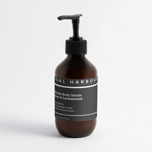 Brown bottle with black pump and label on a white background