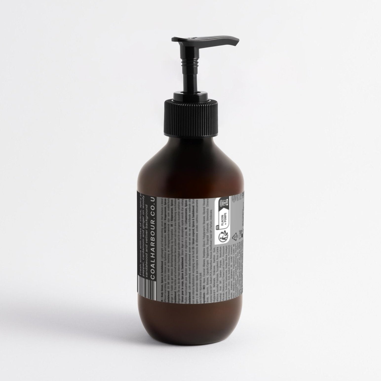 Brown bottle with pump and label on a white background