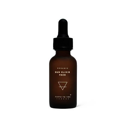 Brown glass bottle with dropper labeled 'Sun Elixir Face' on a white background