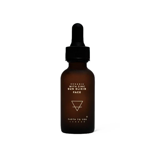 Brown glass bottle with dropper labeled 'Earth to You' on a white background