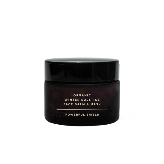 Black jar of Organic Winter Solstice Face Balm & Mask on a white background